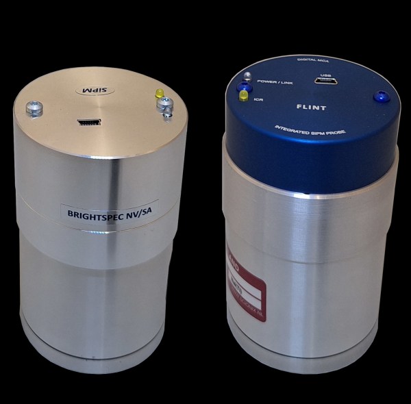Two FLINT units: a NaI(Tl) 2x2 body and a 3x3 body with the blue FLINT front cap